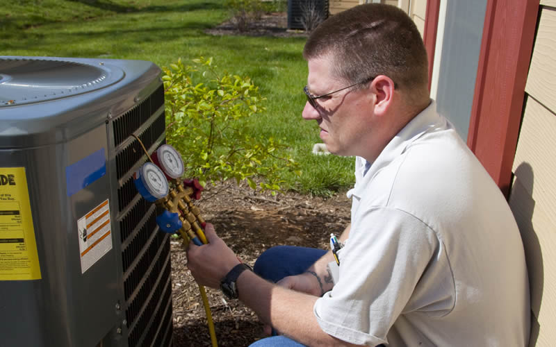 technician inspecting hvac system