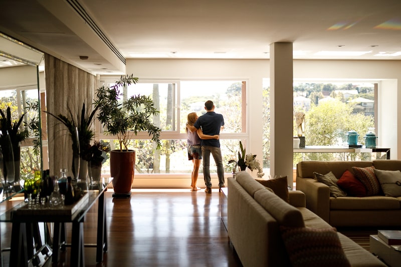 Couple Looking Out Window