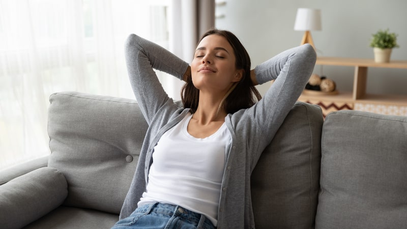 person relaxing on couch