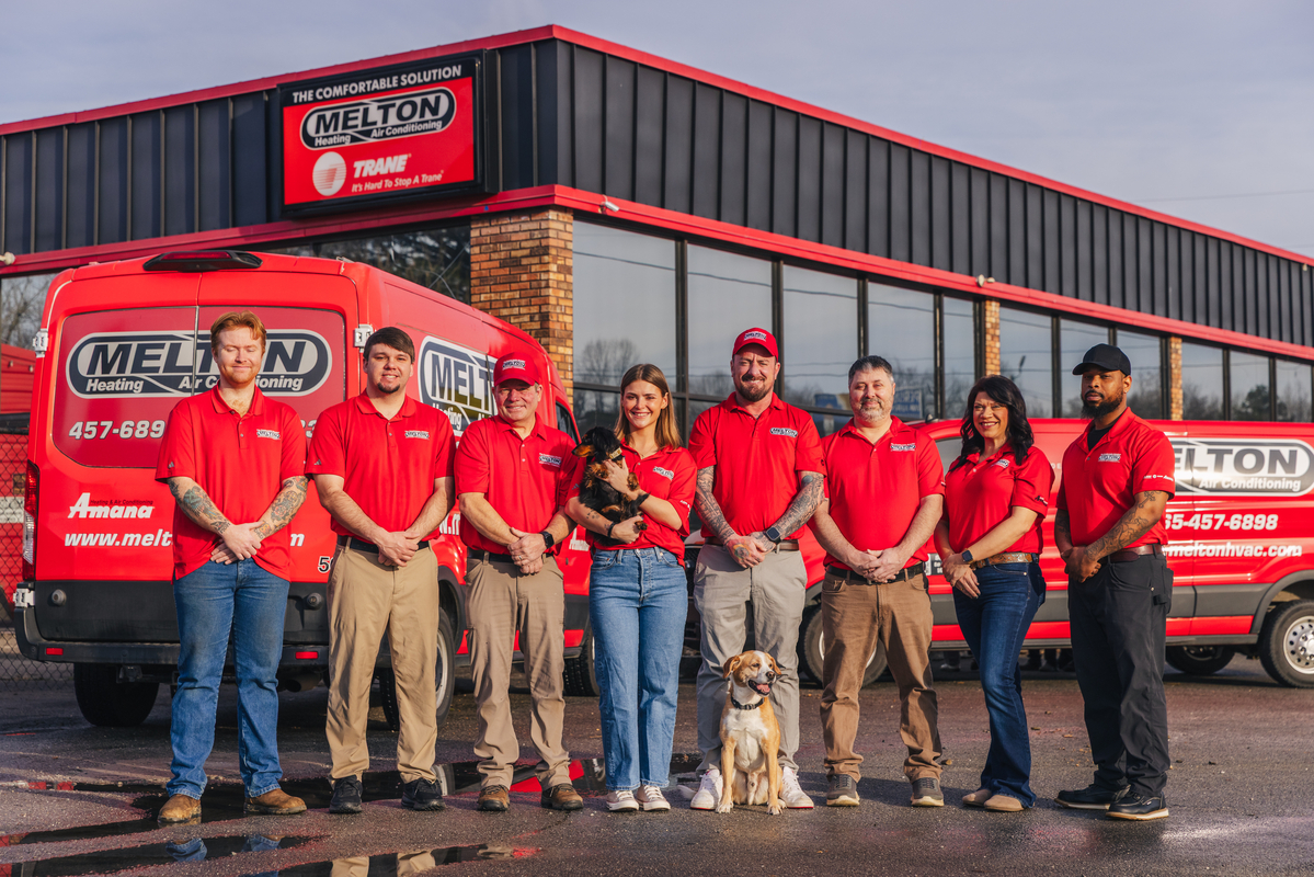 Staff photo infront of building - homepage