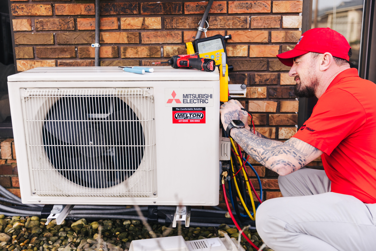 Technician working on ductless unit